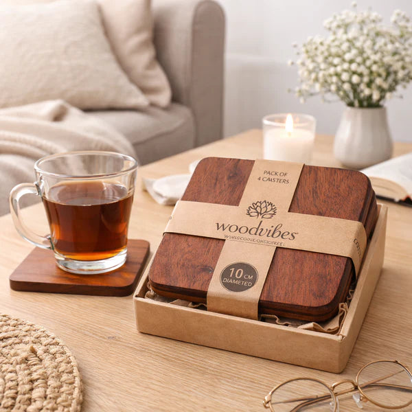 Terra Square Wooden Coasters with a glass of tea on a table in a cozy living room setting.