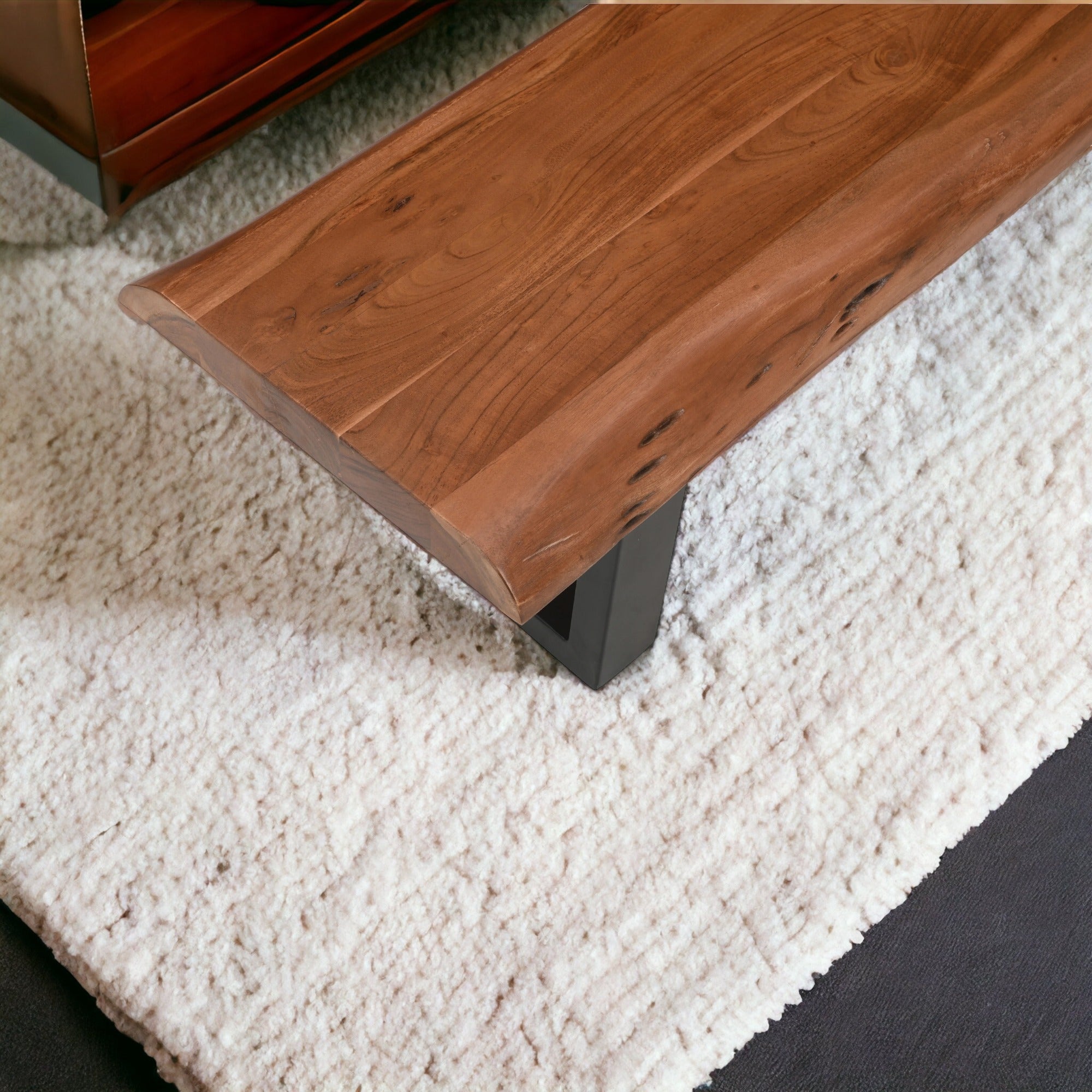 close up of acacia wood live edge bench showing natural grain and texture