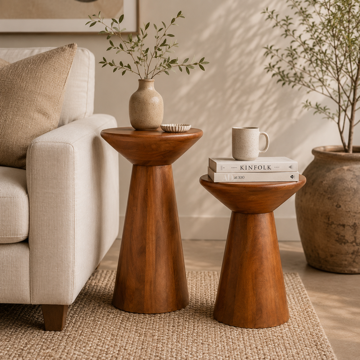 Calyx sculptural accent table set of two styled in a warm neutral living room
