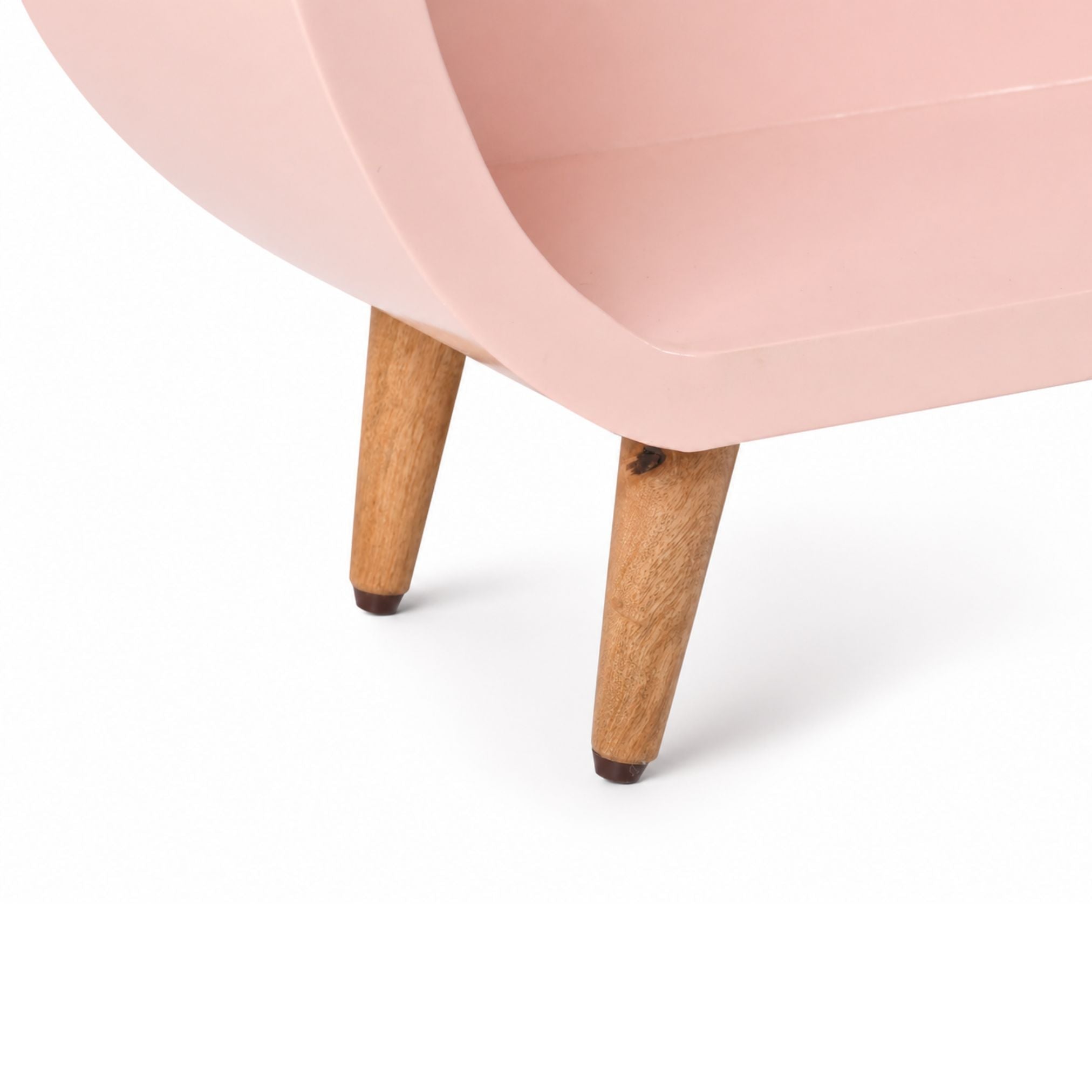 Close-up of solid wooden legs of capsule kids bookshelf highlighting craftsmanship