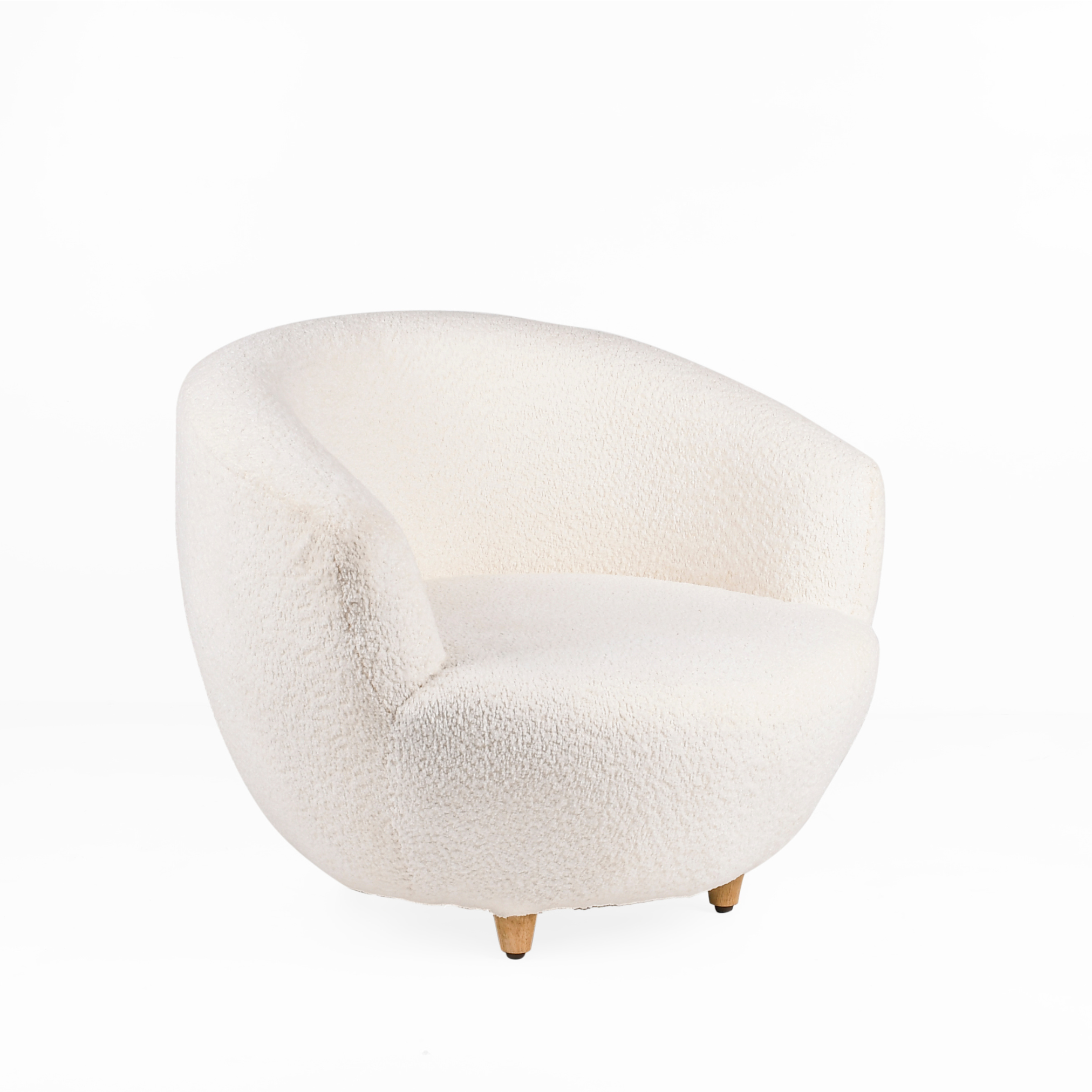 Angled view of Cocoon upholstered kids lounge chair with rounded sculptural silhouette