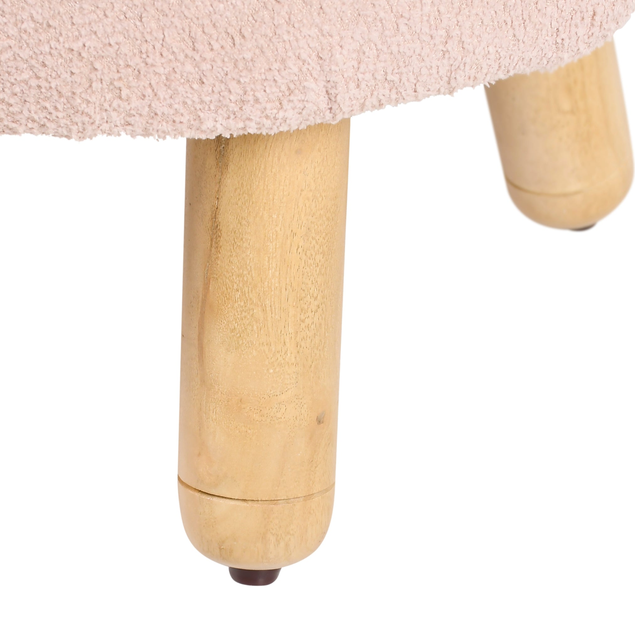 Close-up of wooden leg detail of pink upholstered kids lounge chair