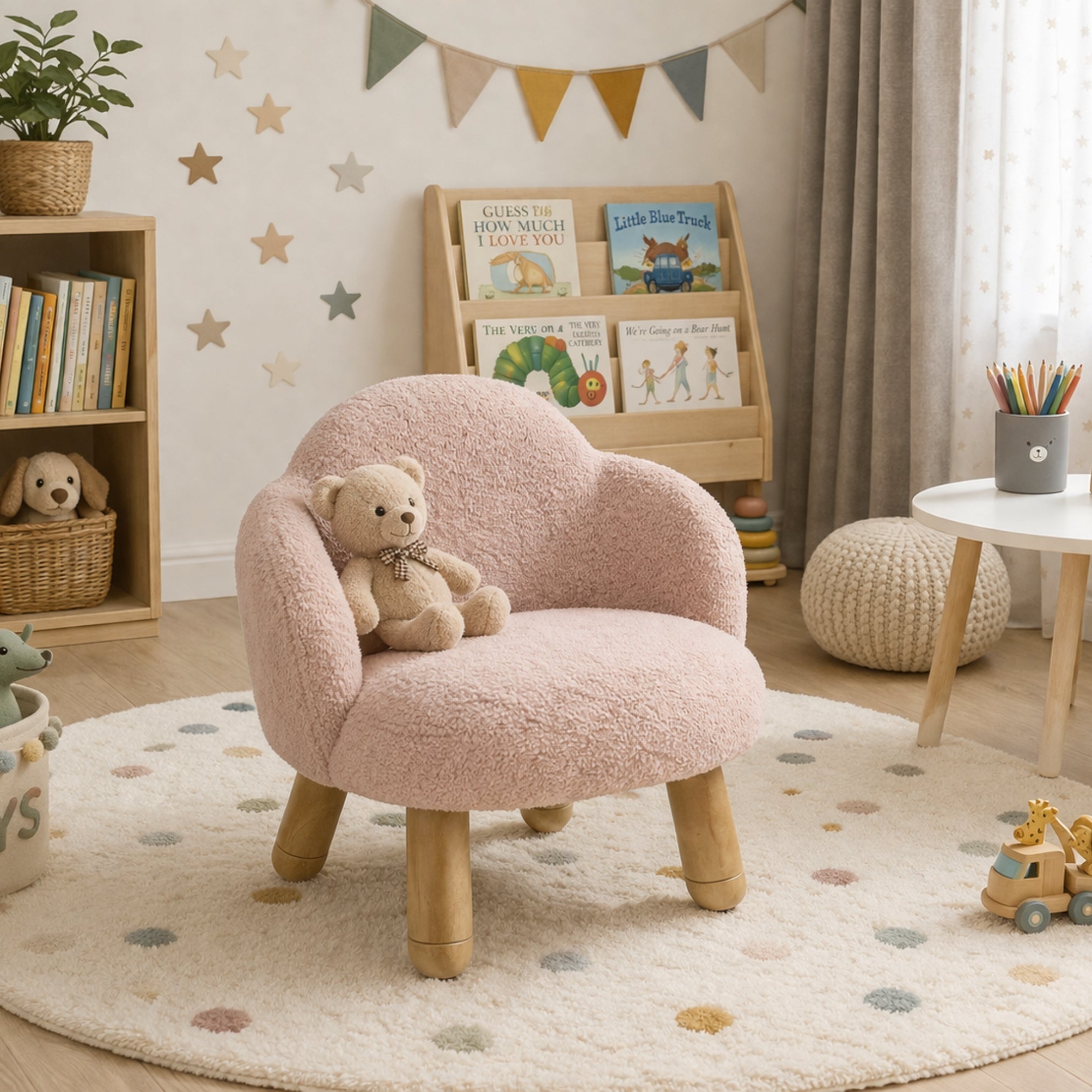 Pink upholstered kids lounge chair with teddy placed in a cozy nursery room setting