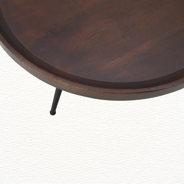 Close-up of solid mango wood grain with natural texture and warm brown finish