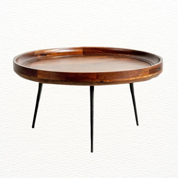 Front view of round mango wood coffee table with sleek metal legs
