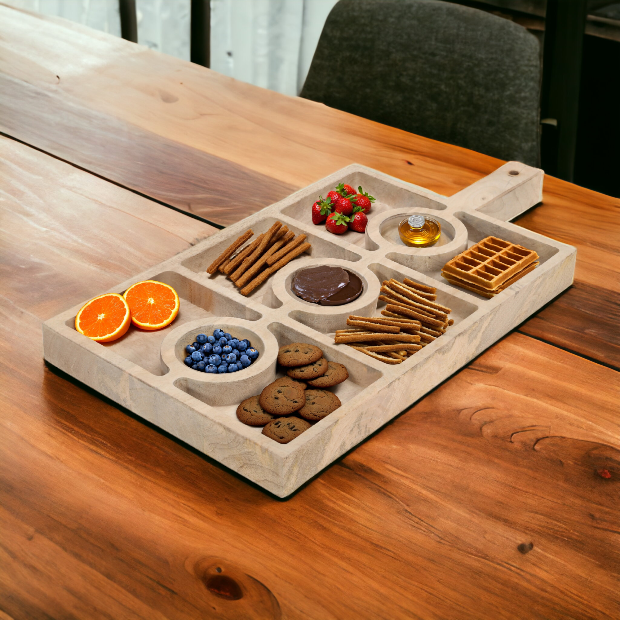 Mango wood serving tray with 9 sections styled on a coffee table with snacks and decorative accents