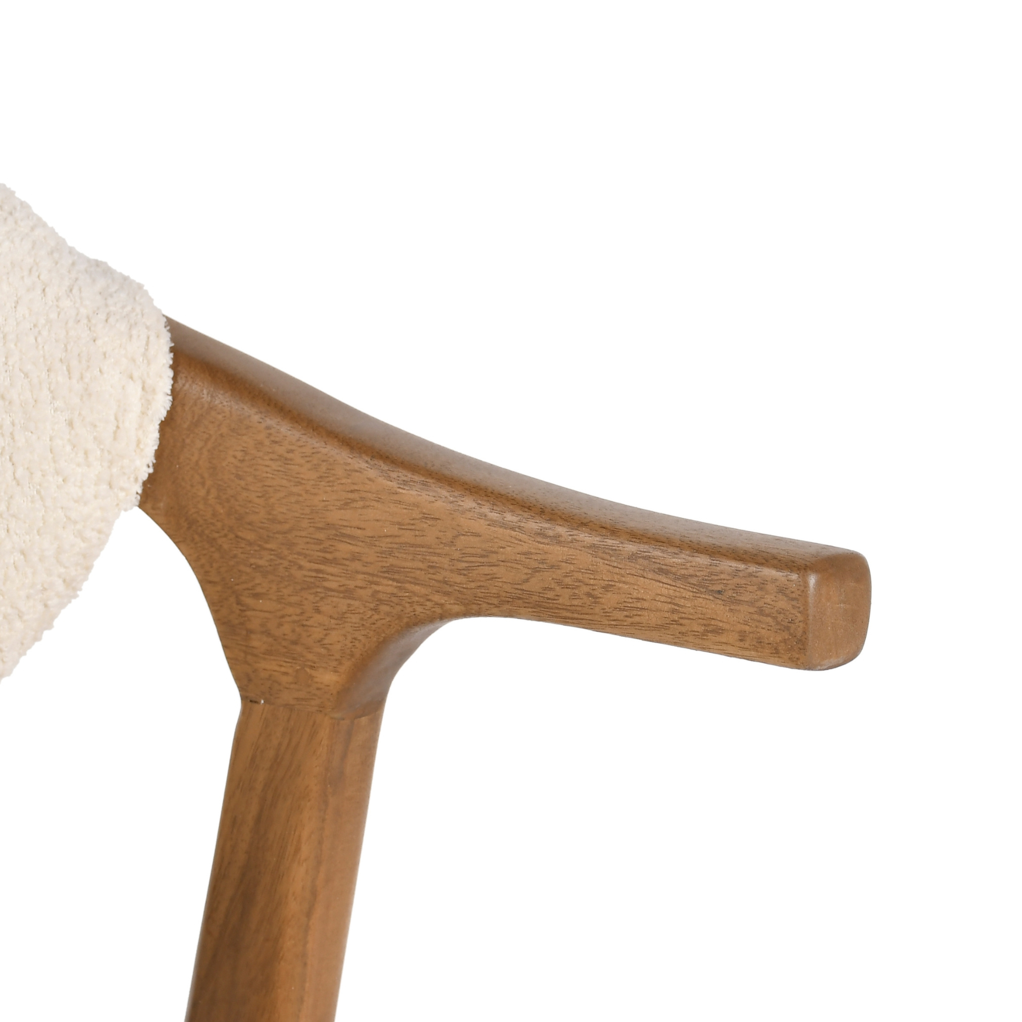 Close-up of wooden armrest detail on beige upholstered kids chair
