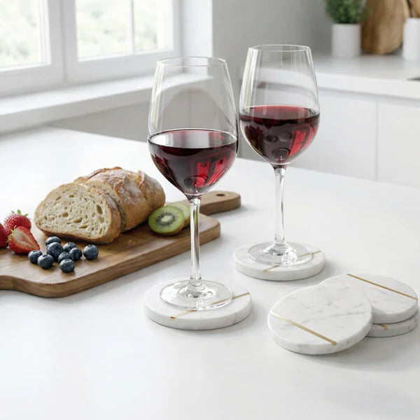 Two glasses of red wine on Lumen Marble Coasters 
