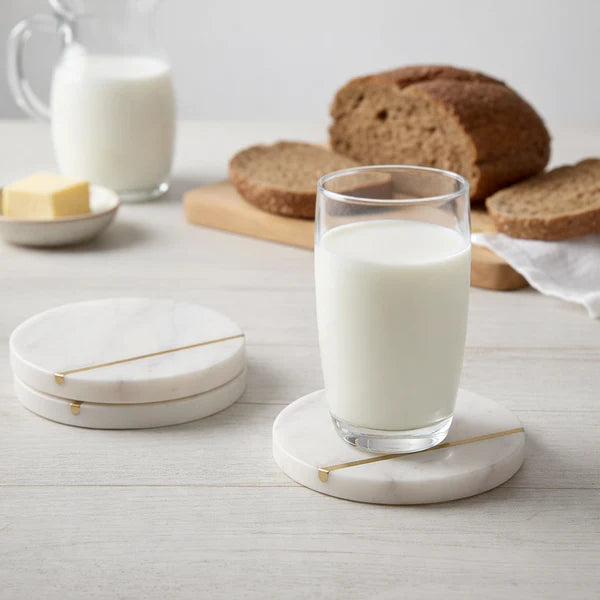 Glass of milk on a Lumen Marble Coasters