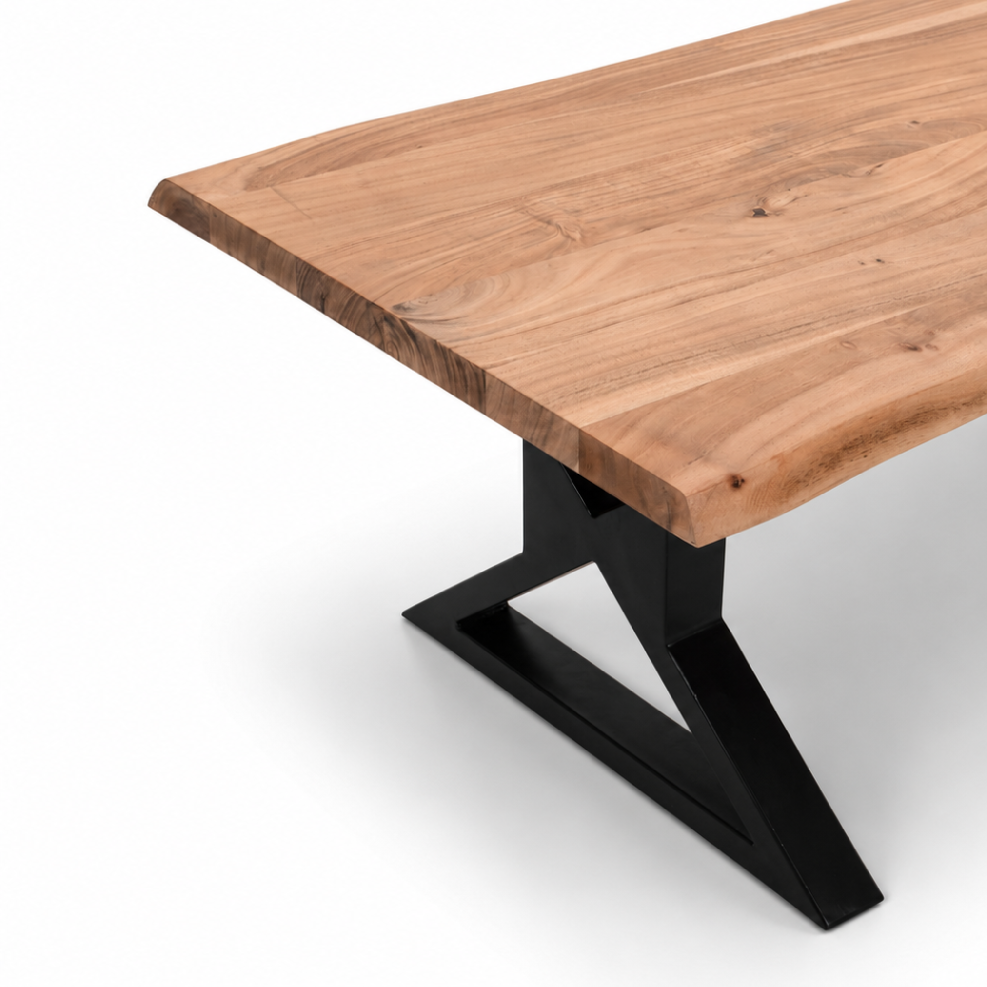 Close-up detail of acacia wood grain and live edge finish on coffee table with black X-leg base.