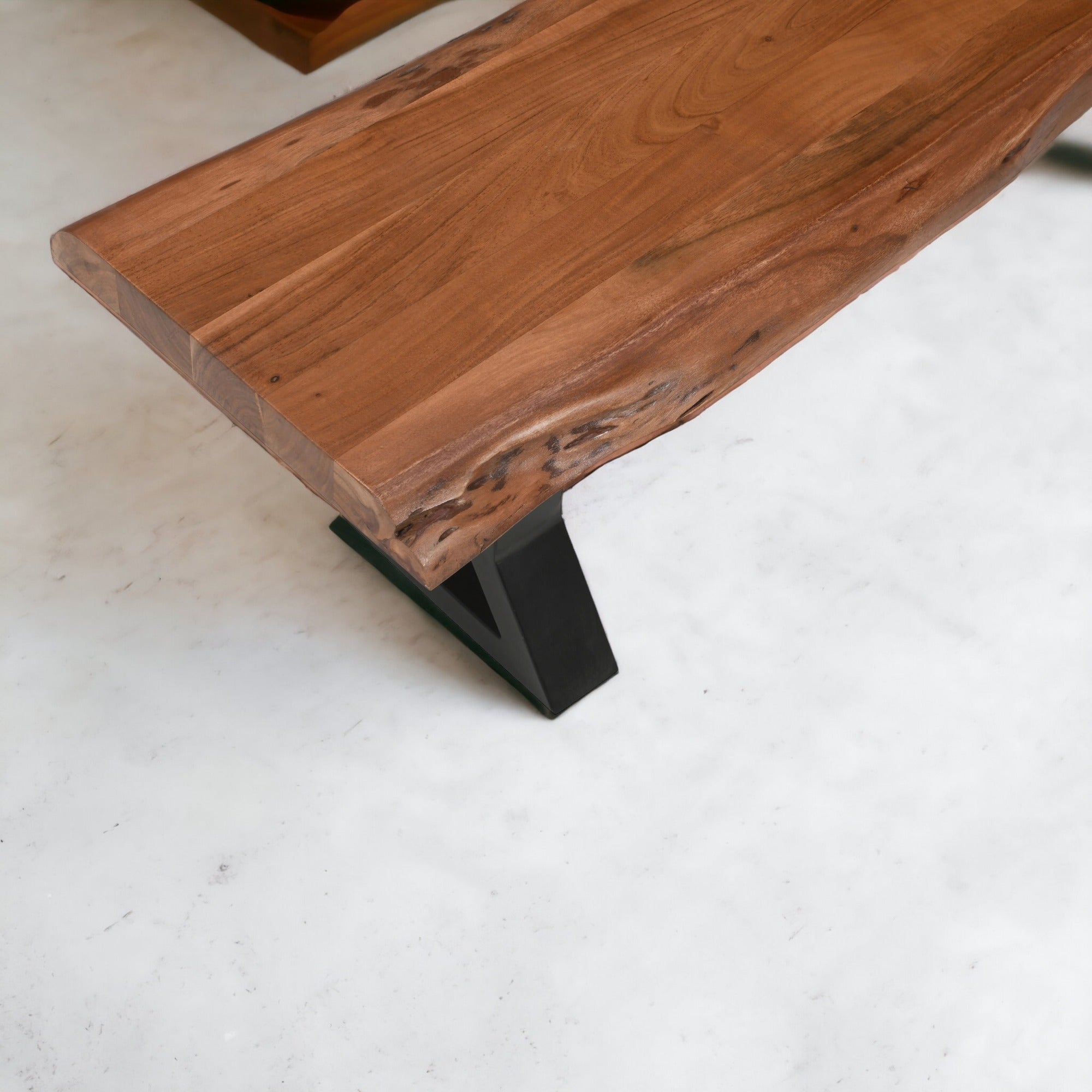 Close up of live edge acacia wood bench top showing natural grain texture and finish