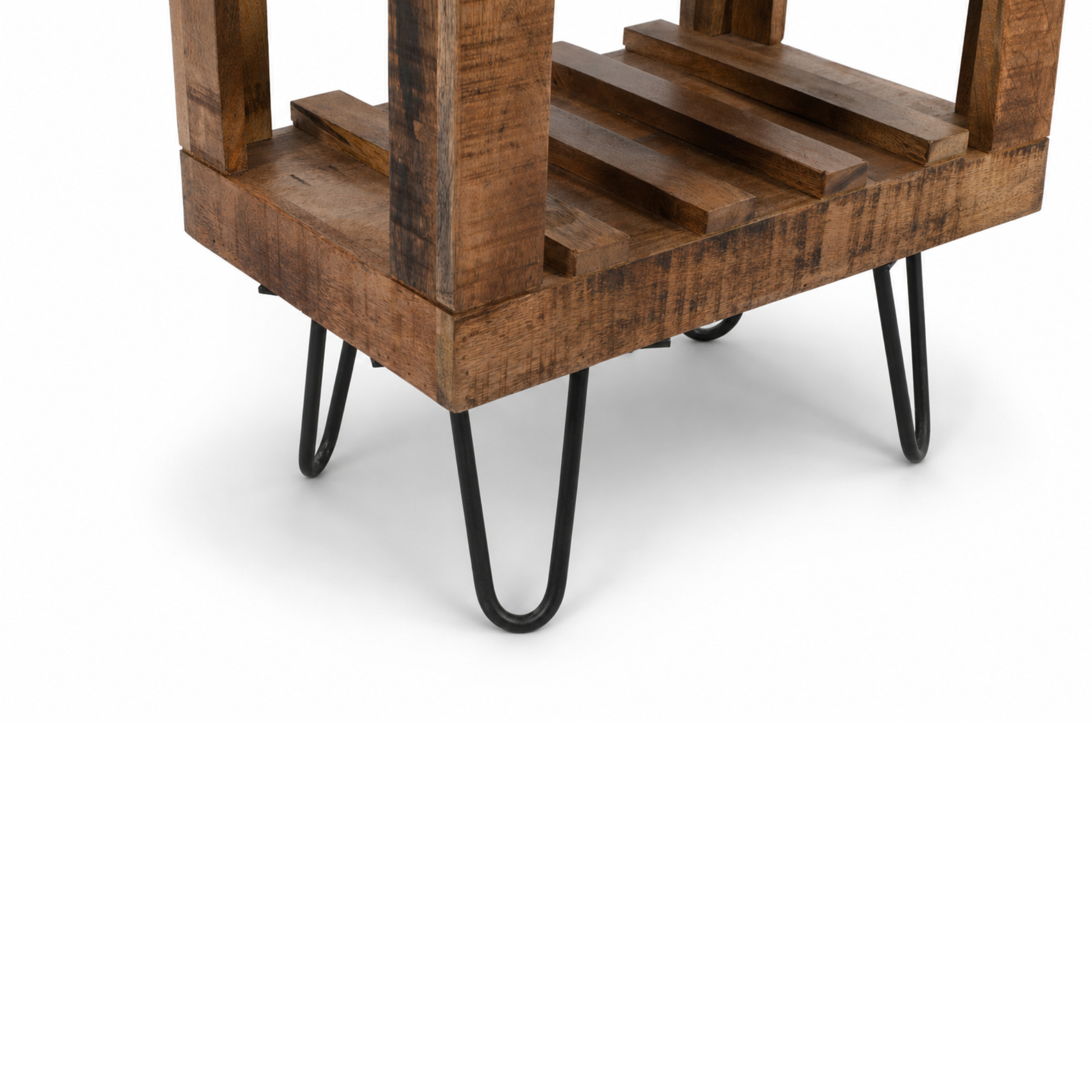 Close-up detail of handcrafted mango wood bar cabinet with black metal hairpin legs
