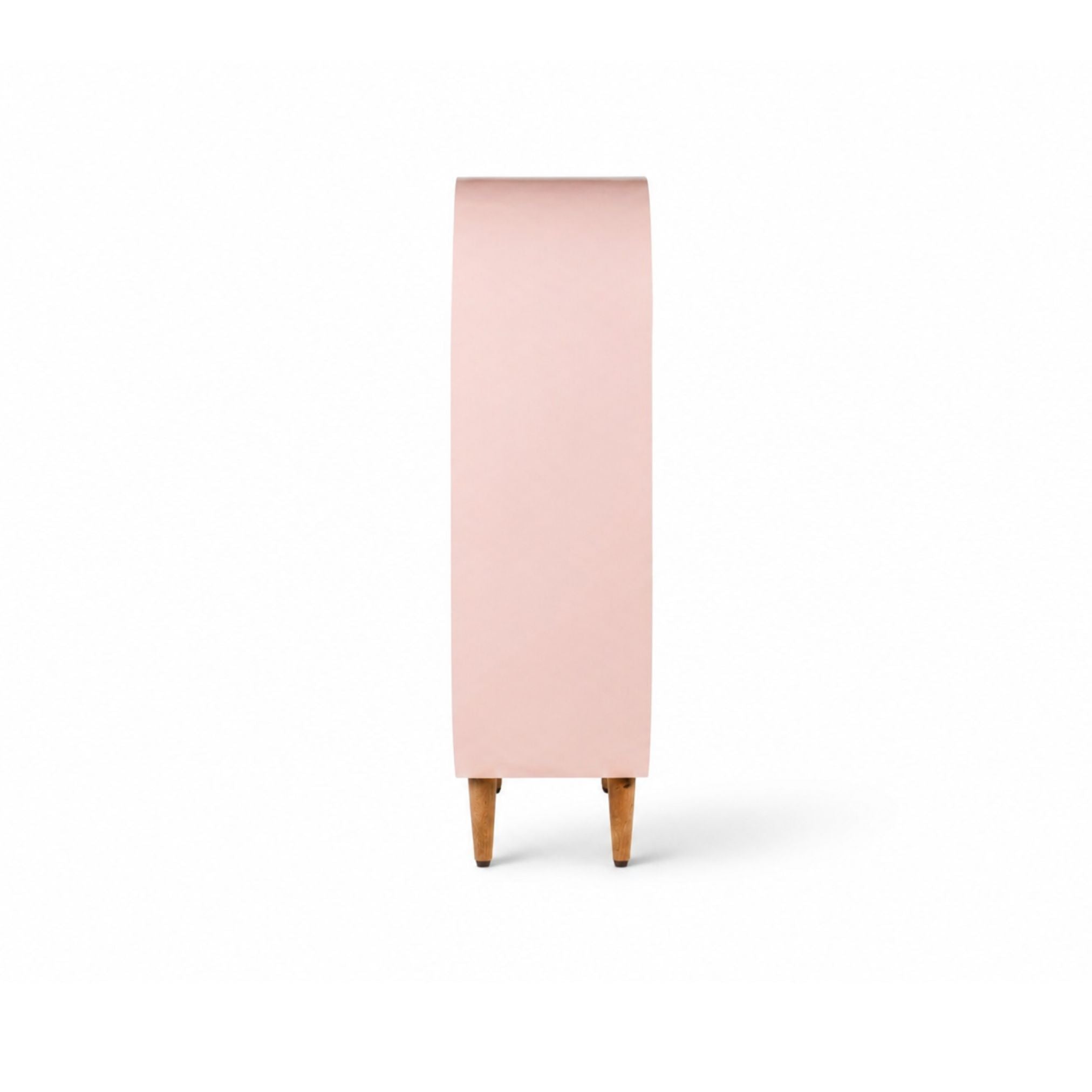 Side view of capsule kids bookshelf showing curved depth and compact storage design