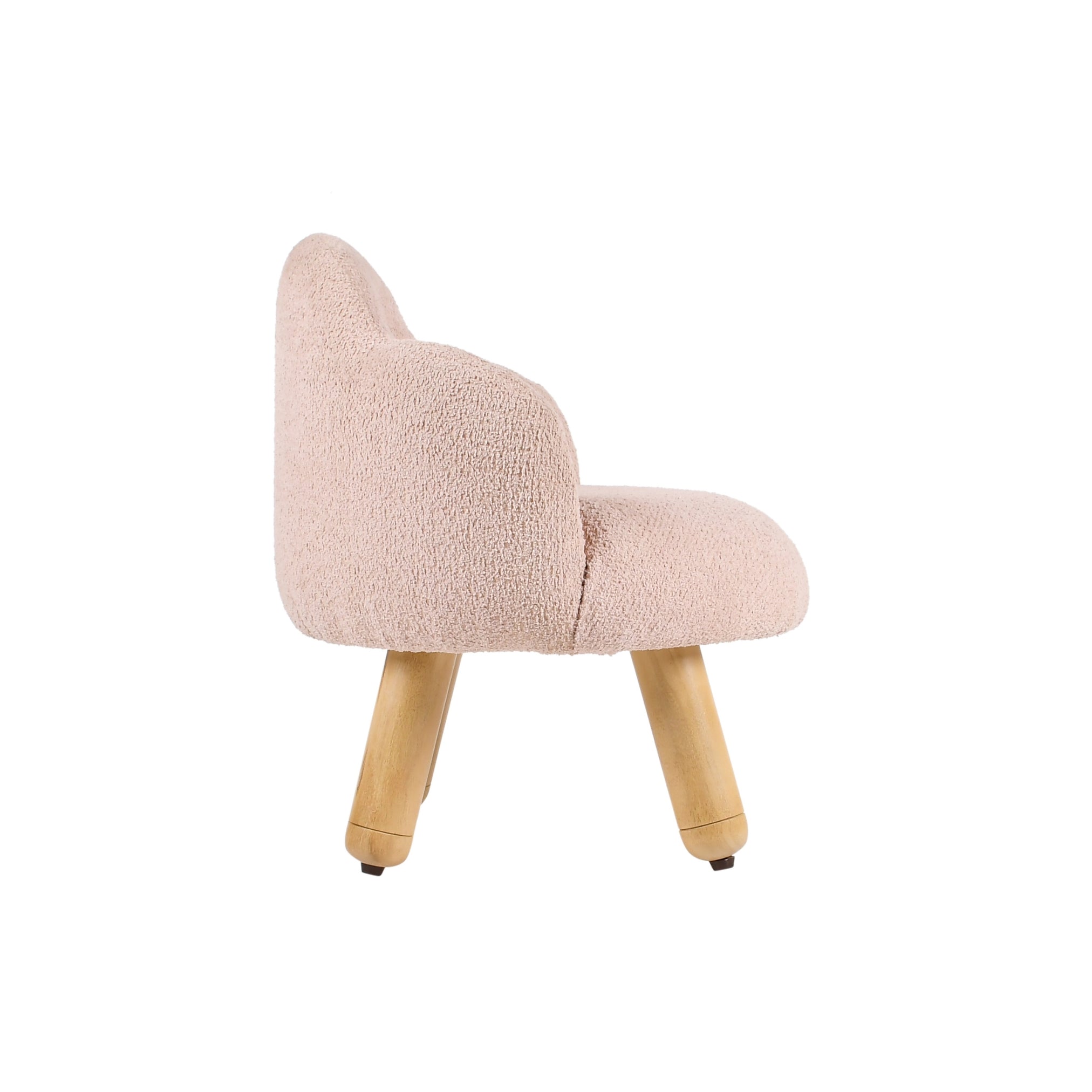 Side profile of pink upholstered kids lounge chair with sturdy wooden legs