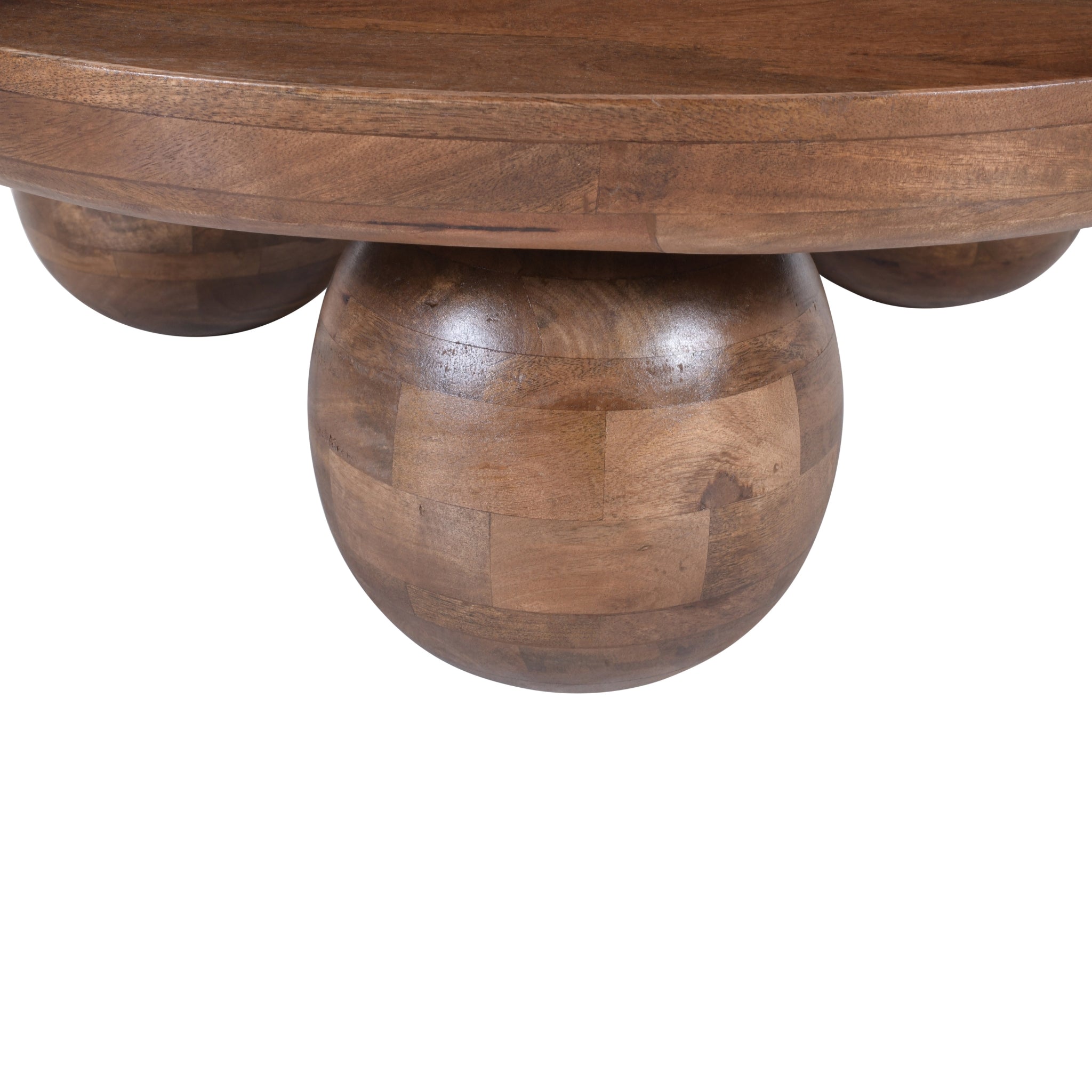 close up of handcrafted mango wood coffee table showing smooth finish and detailing