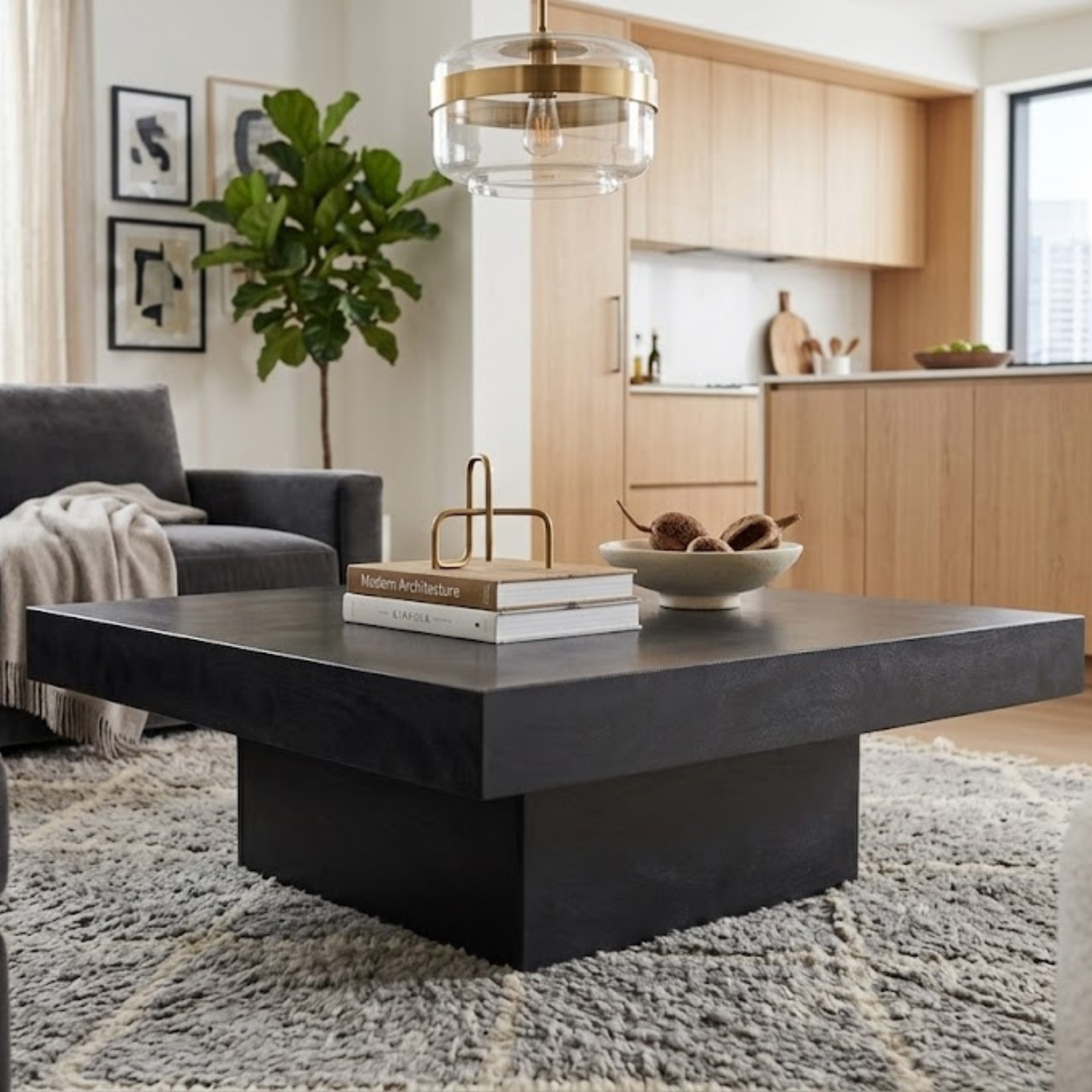 Nova square coffee table in black mango wood styled in a modern living room