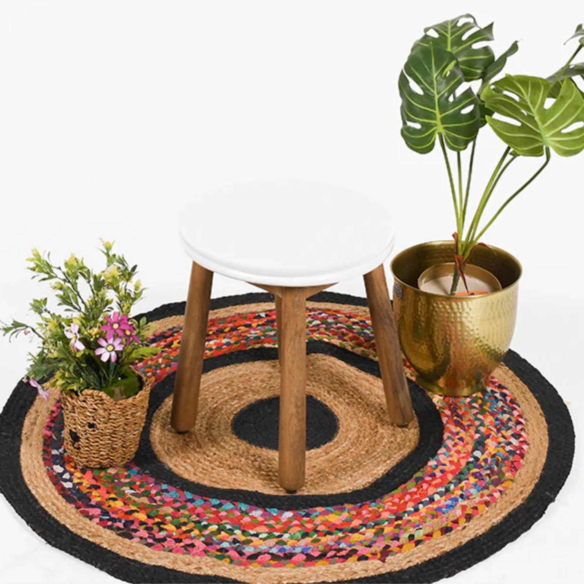 round wooden stool with white top on woven rug