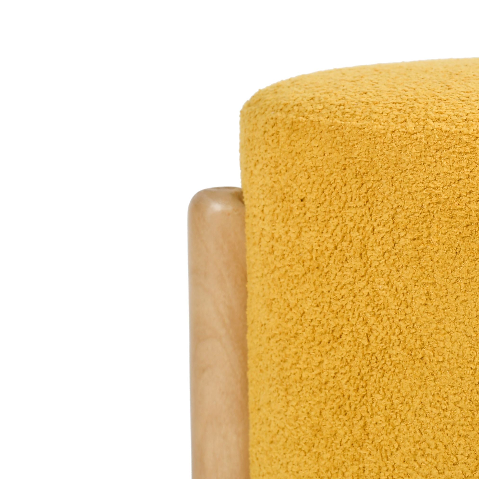 Close-up of textured yellow upholstery fabric on Piko wooden stool