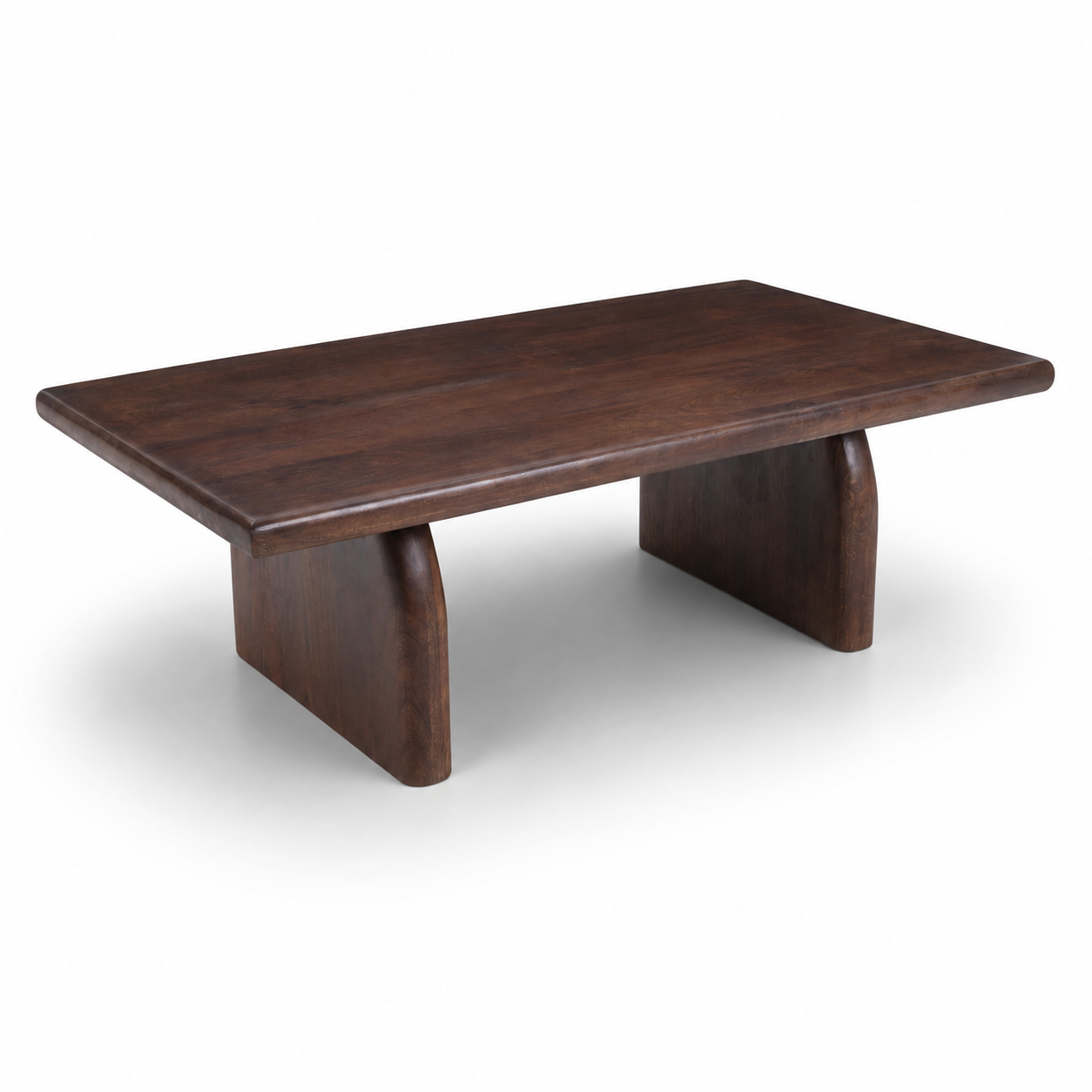 Side profile of Sojourn Rectangular Coffee Table made from solid mango wood with contemporary architectural base