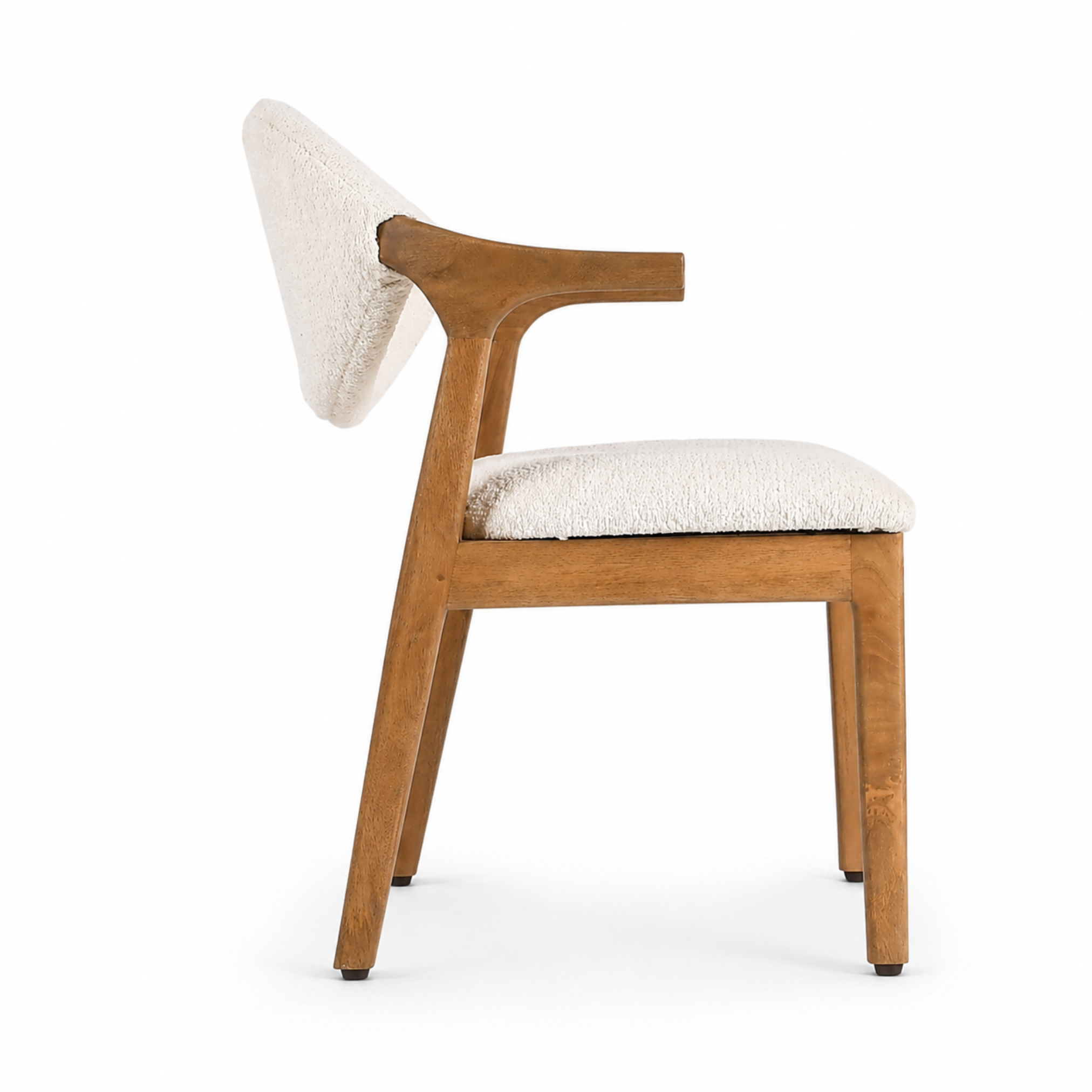 Side profile of beige upholstered wooden kids chair with curved armrests
